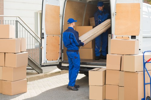 Student removals service helping with moving boxes in Queensway