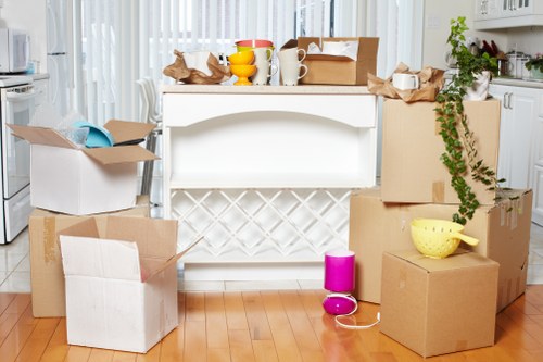 Packed household boxes ready for a smooth move in Queensway