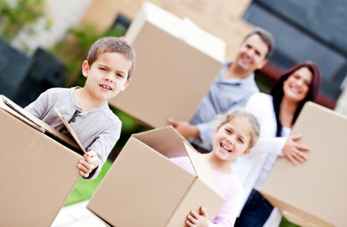 Professional packing for office relocation services in Queensway with labeled boxes