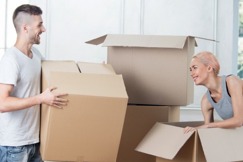 Removal team loading household items into a van during a UK move